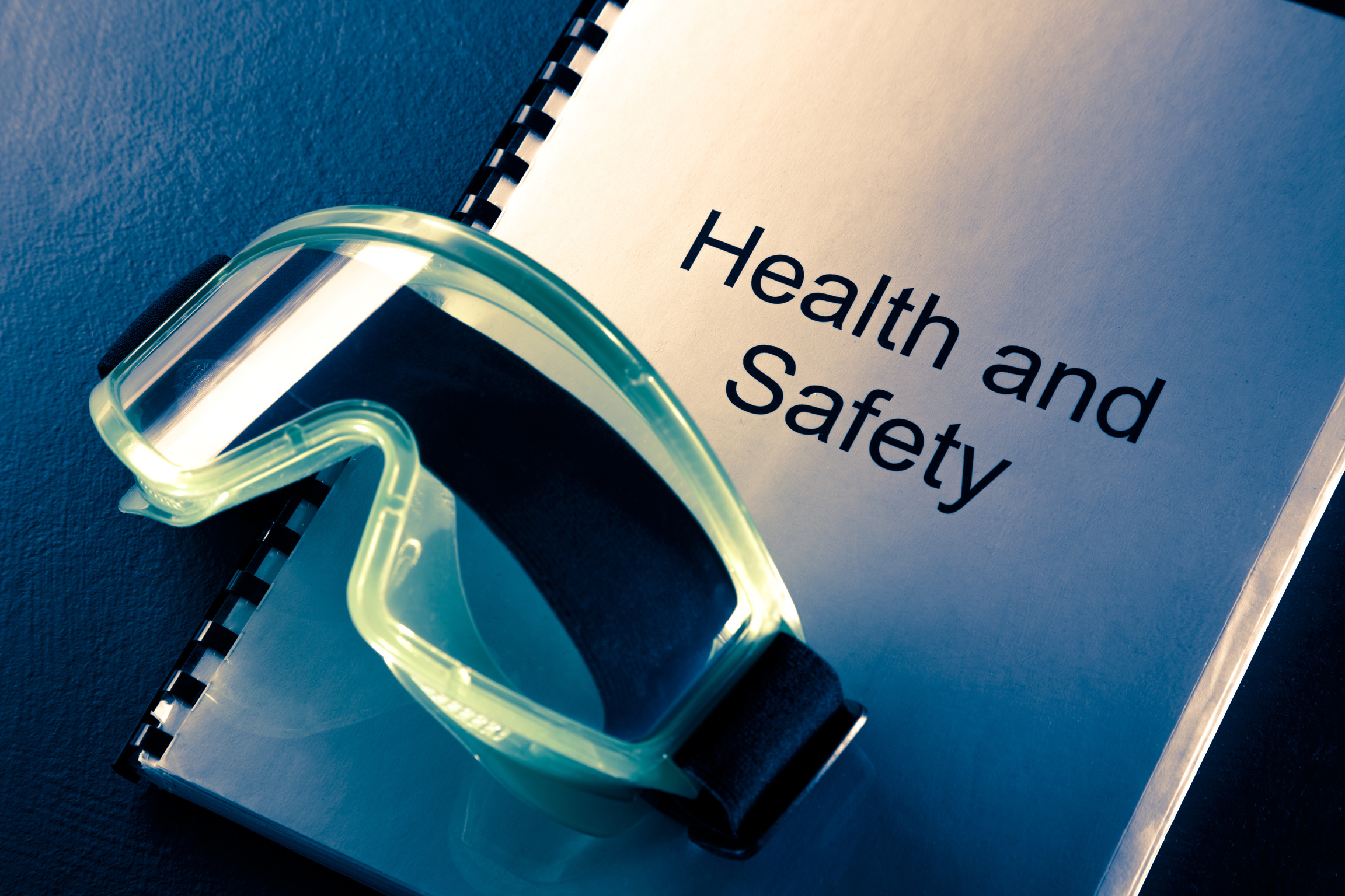 Health and safety document with goggles